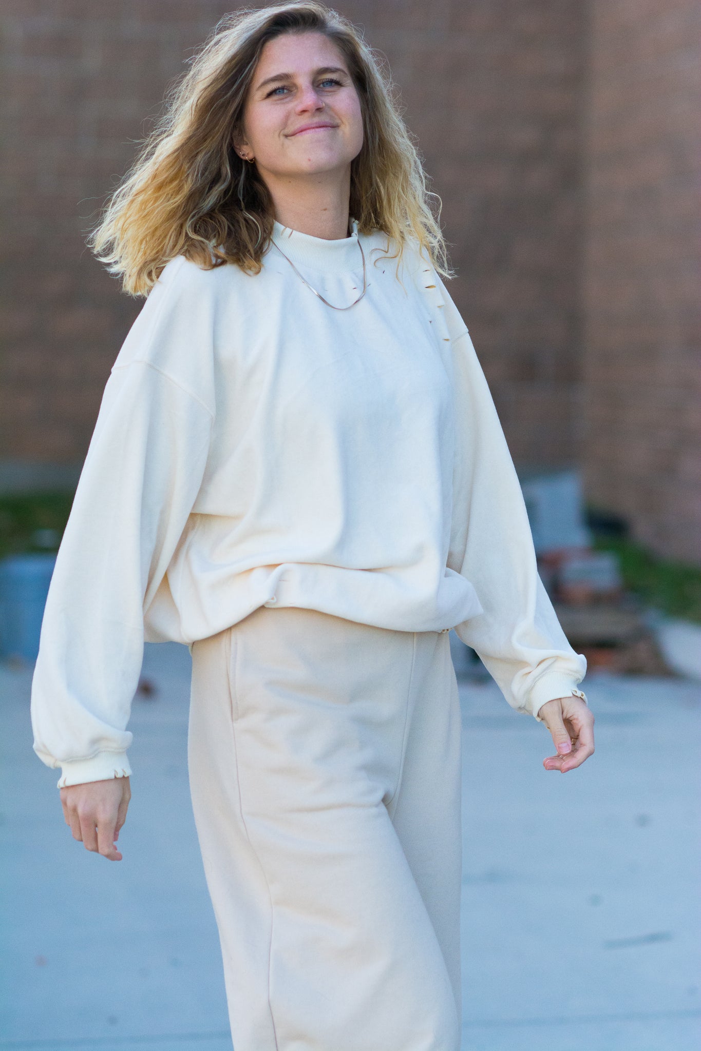 ESSENTIALS DISTRESSED MOCK NECK SWEATSHIRT IN CREAM KITS BRAND  affordable Womens and Mens trendy online streetwear fashion boutique 