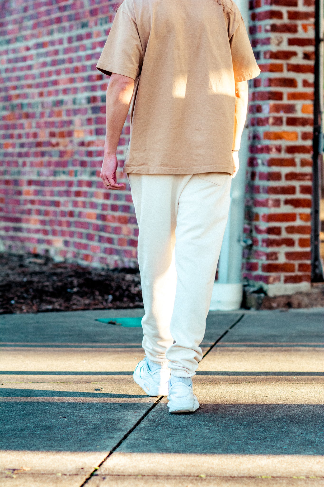 ESSENTIALS SWEATPANTS IN CREAM KITS BRAND  affordable Womens and Mens trendy online streetwear fashion boutique 